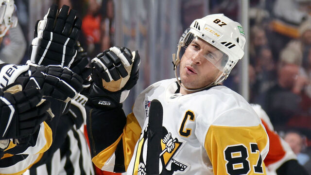 PHILADELPHIA, PENNSYLVANIA - OCTOBER 28: Sidney Crosby #87 of the Pittsburgh Penguins celebrates his third period goal with teammates on the bench against the Philadelphia Flyers at the Xfinity Mobile Arena on October 28, 2025 in Philadelphia, Pennsylvania.
