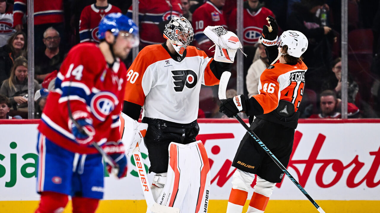 MONTREAL, CANADA - NOVEMBER 04: Dan Vladar #80 and Trevor Zegras #46 of the Philadelphia Flyers celebrate a victory against the Montréal Canadiens at the Bell Centre on November 4, 2025 in Montreal, Quebec, Canada. The Philadelphia Flyers defeated the Montréal Canadiens 5-4 in a shootout.