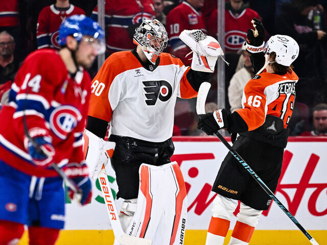 MONTREAL, CANADA - NOVEMBER 04: Dan Vladar #80 and Trevor Zegras #46 of the Philadelphia Flyers celebrate a victory against the Montréal Canadiens at the Bell Centre on November 4, 2025 in Montreal, Quebec, Canada. The Philadelphia Flyers defeated the Montréal Canadiens 5-4 in a shootout.