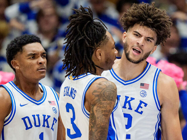 DURHAM, NORTH CAROLINA - OCTOBER 21: (R-L) Cameron Boozer #12 of the Duke Blue Devils celebrates with Isaiah Evans #3 and Caleb Foster #1 during their game against the UCF Knights at Cameron Indoor Stadium on October 21, 2025 in Durham, North Carolina.