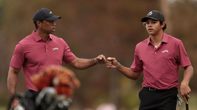 ORLANDO, FLORIDA - DECEMBER 22: Tiger Woods of the United States and his son Charlie Woods react on the 16th green during the second round of the PNC Championship at Ritz-Carlton Golf Club on December 22, 2024 in Orlando, Florida.