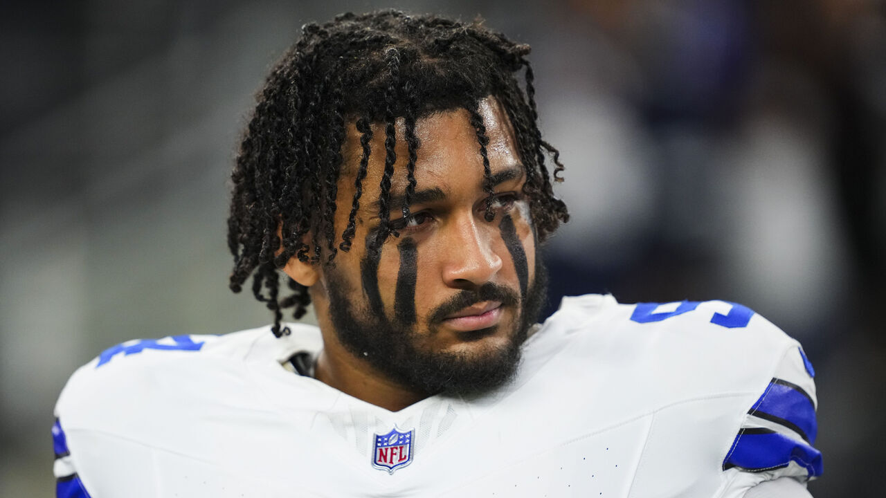 ARLINGTON, TX - DECEMBER 22: Marshawn Kneeland #94 of the Dallas Cowboys looks on from the sideline during the national anthem prior to an NFL football game against the Tampa Bay Buccaneers at AT&T Stadium on December 22, 2024 in Arlington, Texas.
