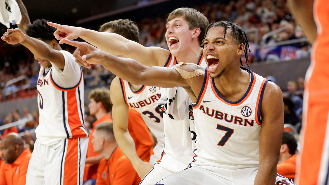 AUBURN, ALABAMA - NOVEMBER 6: Keyshawn Hall #7 of the Auburn Tigers reacts alongside teammates to a slam dunk during the second half against the Merrimack Warriors at Neville Arena on November 6, 2025 in Auburn, Alabama.