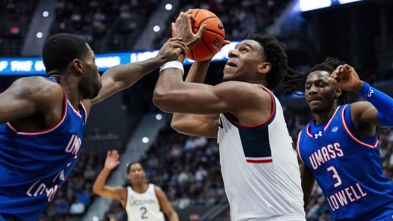 HARTFORD, CONNECTICUT - NOVEMBER 07: Tarris Reed Jr. #5 of the Connecticut Huskies is fouled by the UMass Lowell River Hawks during the first half of an NCAA men's basketball game at PeoplesBank Arena on November 07, 2025 in Hartford, Connecticut.