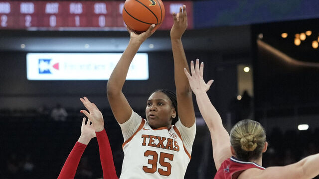AUSTIN, TEXAS - NOVEMBER 7: Madison Booker #35 of the Texas Longhorns shoots over Ally Sweeney #14 and Maggie Doogan #44 of the Richmond Spiders during the first half at Moody Center on November 7, 2025 in Austin, Texas.