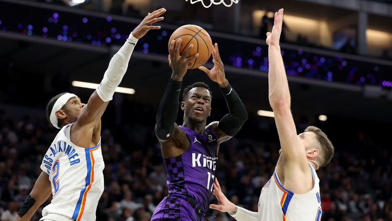 SACRAMENTO, CALIFORNIA - NOVEMBER 07: Dennis Schroder #17 of the Sacramento Kings goes up for a shot on Isaiah Hartenstein #55 and Shai Gilgeous-Alexander #2 of the Oklahoma City Thunder during the second half at Golden 1 Center on November 07, 2025 in Sacramento, California. NOTE TO USER: User expressly acknowledges and agrees that, by downloading and/or using this photograph, user is consenting to the terms and conditions of the Getty Images License Agreement.