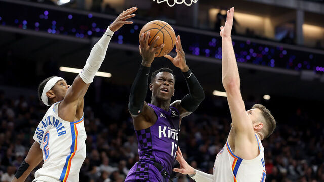 SACRAMENTO, CALIFORNIA - NOVEMBER 07: Dennis Schroder #17 of the Sacramento Kings goes up for a shot on Isaiah Hartenstein #55 and Shai Gilgeous-Alexander #2 of the Oklahoma City Thunder during the second half at Golden 1 Center on November 07, 2025 in Sacramento, California. NOTE TO USER: User expressly acknowledges and agrees that, by downloading and/or using this photograph, user is consenting to the terms and conditions of the Getty Images License Agreement.