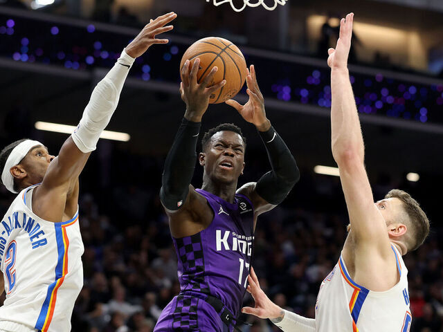 SACRAMENTO, CALIFORNIA - NOVEMBER 07: Dennis Schroder #17 of the Sacramento Kings goes up for a shot on Isaiah Hartenstein #55 and Shai Gilgeous-Alexander #2 of the Oklahoma City Thunder during the second half at Golden 1 Center on November 07, 2025 in Sacramento, California. NOTE TO USER: User expressly acknowledges and agrees that, by downloading and/or using this photograph, user is consenting to the terms and conditions of the Getty Images License Agreement.