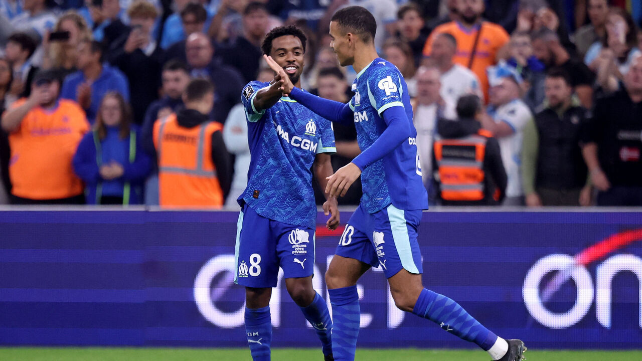 Marseille's English forward #10 Mason Greenwood (L) is congratulated by Marseille's British midfielder #08 Angel Gomes (R) after scoring his team's second goal during the French L1 football match between Olympique de Marseille (OM) and Stade Brestois 29 (Brest) at the Stade Velodrome in Marseille, southern France, on November 8, 2025.