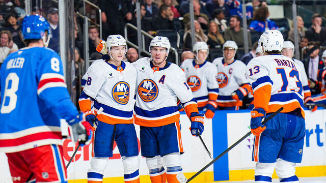 NEW YORK, NEW YORK - NOVEMBER 08: Bo Horvat #14 of the New York Islanders celebrates with teammates after scoring a goal in the second period against the New York Rangers at Madison Square Garden on November 8, 2025 in New York City.