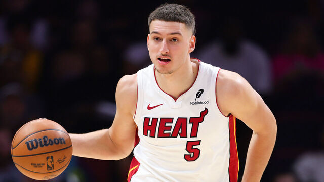 MIAMI, FLORIDA - OCTOBER 28: Nikola Jovic #5 of the Miami Heat dribbles the ball against the Charlotte Hornets during the second quarter of the game at Kaseya Center on October 28, 2025 in Miami, Florida.
