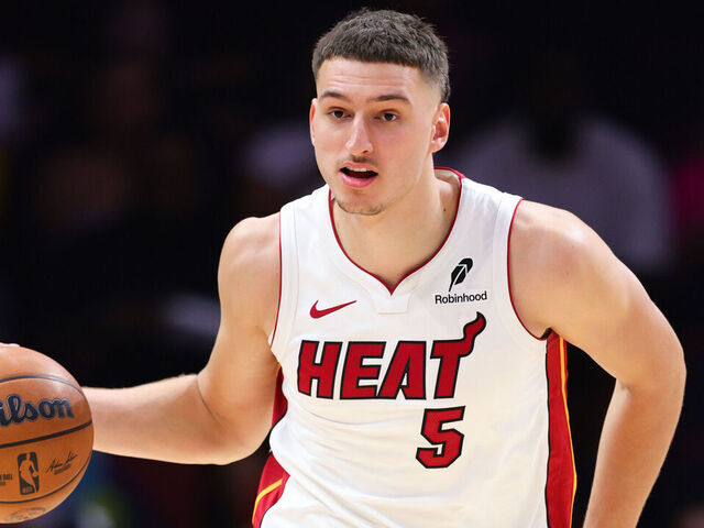 MIAMI, FLORIDA - OCTOBER 28: Nikola Jovic #5 of the Miami Heat dribbles the ball against the Charlotte Hornets during the second quarter of the game at Kaseya Center on October 28, 2025 in Miami, Florida.