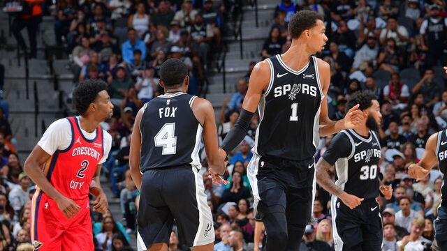 SAN ANTONIO, TX - NOVEMBER 8: De'Aaron Fox #4 and Victor Wembanyama #1 of the San Antonio Spurs high five during the game against the New Orleans Pelicans on November 8, 2025 at the Frost Bank Center in San Antonio, Texas. Mandatory Copyright Notice: Copyright 2025 NBAE (Photos by Michael Gonzales/NBAE via Getty Images)