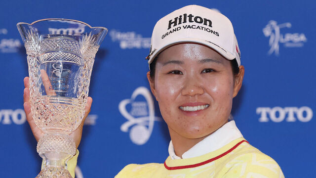 Japan's Nasa Hataoka holds the trophy after winning the LPGA Toto Japan Classic at Seta Golf Course in Otsu City, Shiga Prefecture on November 9, 2025.