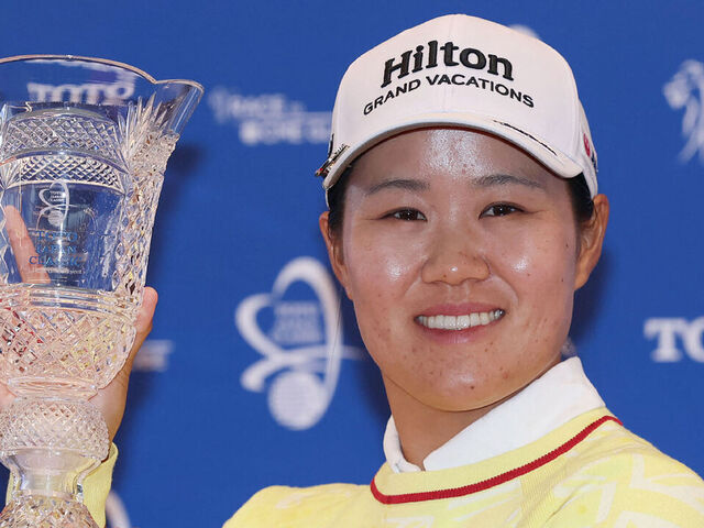 Japan's Nasa Hataoka holds the trophy after winning the LPGA Toto Japan Classic at Seta Golf Course in Otsu City, Shiga Prefecture on November 9, 2025.