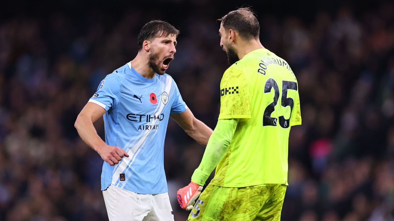 MANCHESTER, ENGLAND - NOVEMBER 9: Ruben Dias celebrates with Gianluigi Donnarumma of Manchester City at full time during the Premier League match between Manchester City and Liverpool at Etihad Stadium on November 9, 2025 in Manchester, England.