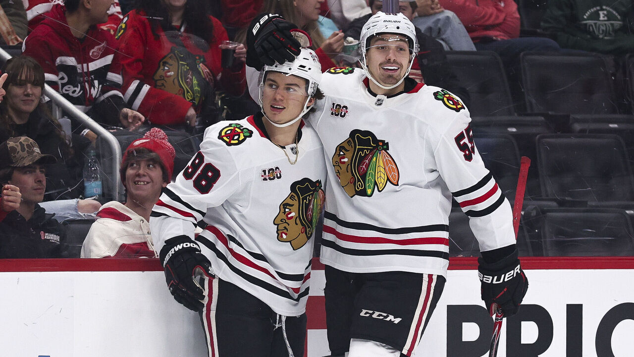 DETROIT, MICHIGAN - NOVEMBER 09: Connor Bedard #98 and Artyom Levshunov #55 of the Chicago Blackhawks celebrate after a goal during the first period of a game against the Detroit Red Wings at Little Caesars Arena on November 09, 2025 in Detroit, Michigan.