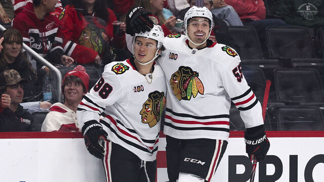 DETROIT, MICHIGAN - NOVEMBER 09: Connor Bedard #98 and Artyom Levshunov #55 of the Chicago Blackhawks celebrate after a goal during the first period of a game against the Detroit Red Wings at Little Caesars Arena on November 09, 2025 in Detroit, Michigan.