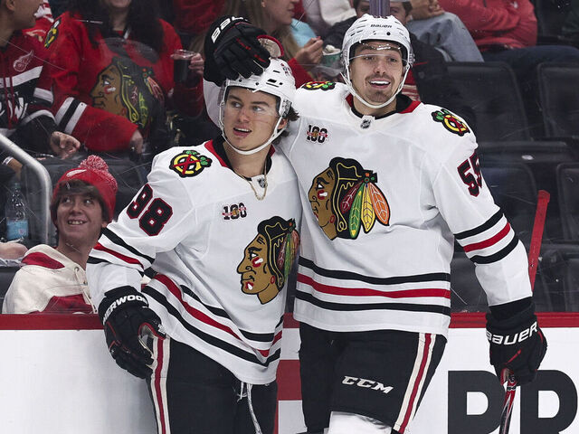 DETROIT, MICHIGAN - NOVEMBER 09: Connor Bedard #98 and Artyom Levshunov #55 of the Chicago Blackhawks celebrate after a goal during the first period of a game against the Detroit Red Wings at Little Caesars Arena on November 09, 2025 in Detroit, Michigan.