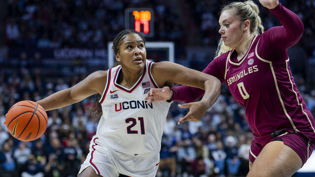 STORRS, CONNECTICUT - NOVEMBER 09: Sarah Strong #21 of the Connecticut Huskies is defended by Allie Kubek #0 of the Florida State Seminoles during the first half of an NCAA women's basketball game exhibition at Harry A. Gampel Pavilion on November 09, 2025 in Storrs, Connecticut.