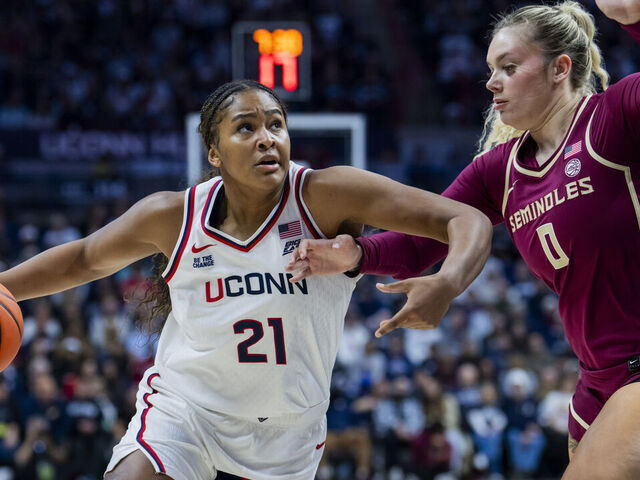 STORRS, CONNECTICUT - NOVEMBER 09: Sarah Strong #21 of the Connecticut Huskies is defended by Allie Kubek #0 of the Florida State Seminoles during the first half of an NCAA women's basketball game exhibition at Harry A. Gampel Pavilion on November 09, 2025 in Storrs, Connecticut.
