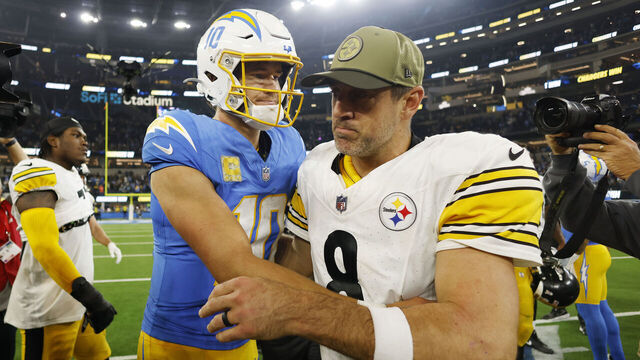 INGLEWOOD, CALIFORNIA - NOVEMBER 09: Aaron Rodgers #8 of the Pittsburgh Steelers and Justin Herbert #10 of the Los Angeles Chargers meet after the Chargers beat the Steelers 25-10 at SoFi Stadium on November 09, 2025 in Inglewood, California.