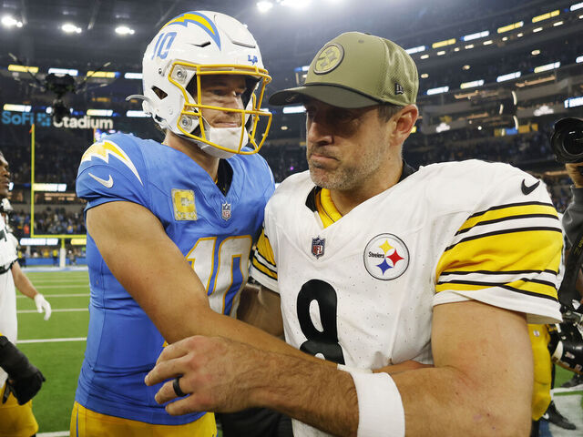 INGLEWOOD, CALIFORNIA - NOVEMBER 09: Aaron Rodgers #8 of the Pittsburgh Steelers and Justin Herbert #10 of the Los Angeles Chargers meet after the Chargers beat the Steelers 25-10 at SoFi Stadium on November 09, 2025 in Inglewood, California.