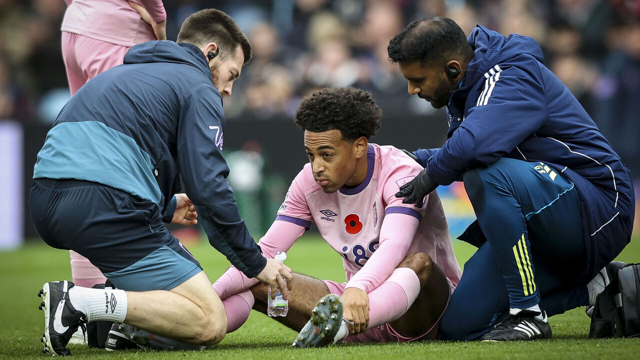 BIRMINGHAM, ENGLAND - NOVEMBER 09: Tyler Adams of Bournemouth receives treatment after a collision with team-mate Adam Smith during the Premier League match between Aston Villa and Bournemouth at Villa Park on November 09, 2025 in Birmingham, England.