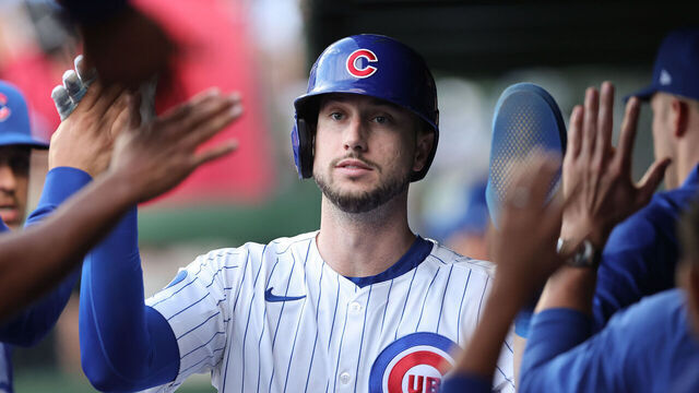 CHICAGO, ILLINOIS - OCTOBER 02: Kyle Tucker #30 of the Chicago Cubs high-fives teammates in the dugout after scoring a run in the second inning against the San Diego Padres in game three of the National League Wild Card Series at Wrigley Field on October 02, 2025 in Chicago, Illinois.