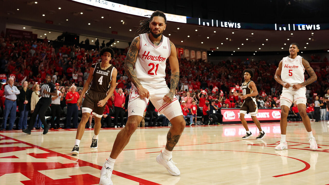 HOUSTON, TEXAS - NOVEMBER 03: Emanuel Sharp #21 of the Houston Cougars reacts after a fast break dunk against the Lehigh Mountain Hawks in the first half of the game at Fertitta Center on November 03, 2025 in Houston, Texas.