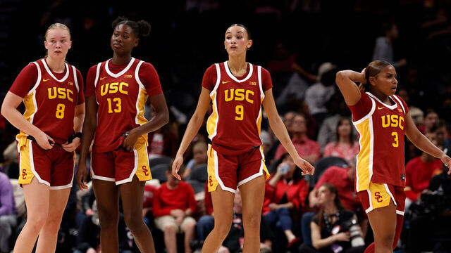 CHARLOTTE, NORTH CAROLINA - NOVEMBER 9: Gerda Raulusaityte #8, Dayana Mendes #13, Jazzy Davidson #9, and Londynn Jones #3 of the USC Trojans return to the court against the NC State Wolfpack in their 2025 Ally Tipoff game at Spectrum Center on November 9, 2025 in Charlotte, North Carolina.