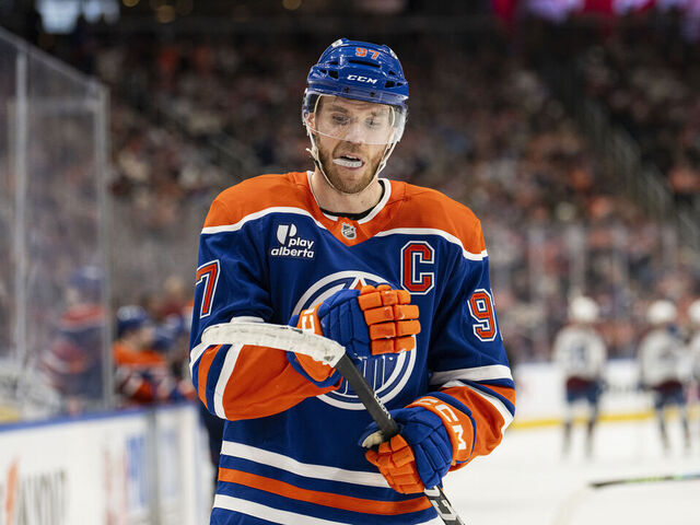 EDMONTON, ALBERTA - NOVEMBER 08: Edmonton Oilers center Connor McDavid (97) cleans his stick during a tv timeout during the second period against the Colorado Avalanche at Rogers Place on November 08, 2025 in Edmonton, Alberta, Canada.