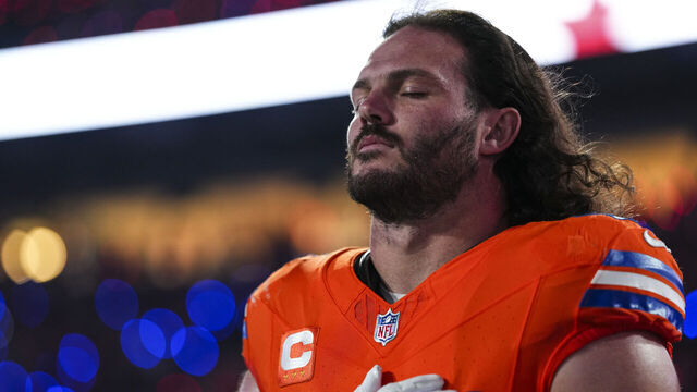 DENVER, CO - NOVEMBER 06: Alex Singleton #49 of the Denver Broncos looks on from the sideline during the national anthem prior to an NFL football game against the Las Vegas Raiders at Empower Field at Mile High on November 6, 2025 in Denver, Colorado.