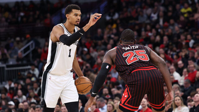 CHICAGO, ILLINOIS - NOVEMBER 10: Victor Wembanyama #1 of the San Antonio Spurs is guarded by Jalen Smith #25 of the Chicago Bulls during the first half at the United Center on November 10, 2025 in Chicago, Illinois.
