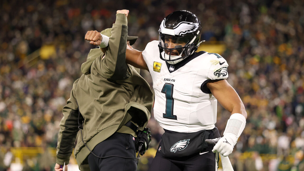 GREEN BAY, WISCONSIN - NOVEMBER 10: Jalen Hurts #1 of the Philadelphia Eagles celebrates a touchdown by DeVonta Smith #6 against the Green Bay Packers during the fourth quarter in the game at Lambeau Field on November 10, 2025 in Green Bay, Wisconsin.