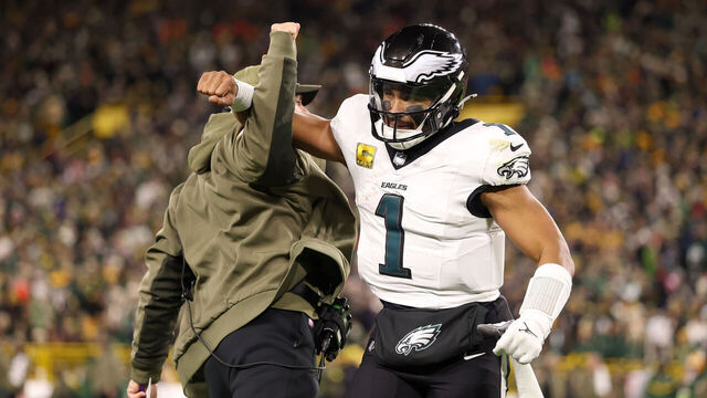 GREEN BAY, WISCONSIN - NOVEMBER 10: Jalen Hurts #1 of the Philadelphia Eagles celebrates a touchdown by DeVonta Smith #6 against the Green Bay Packers during the fourth quarter in the game at Lambeau Field on November 10, 2025 in Green Bay, Wisconsin.