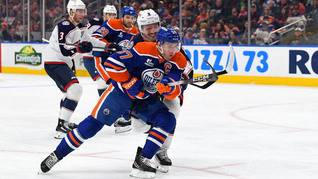 EDMONTON, CANADA - NOVEMBER 10: Connor McDavid #97 of the Edmonton Oilers battles for the puck against Zach Werenski #8 of the Columbus Blue Jackets during the second period of the game at Rogers Place on November 10, 2025, in Edmonton, Alberta, Canada.