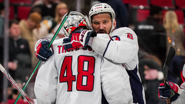 RALEIGH, NORTH CAROLINA - NOVEMBER 11: Logan Thompson #48 of the Washington Capitals celebrates with Alex Ovechkin #8 after a 4-1 victory against the Carolina Hurricanes at Lenovo Center on November 11, 2025 in Raleigh, North Carolina.