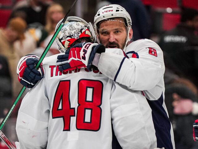 RALEIGH, NORTH CAROLINA - NOVEMBER 11: Logan Thompson #48 of the Washington Capitals celebrates with Alex Ovechkin #8 after a 4-1 victory against the Carolina Hurricanes at Lenovo Center on November 11, 2025 in Raleigh, North Carolina.