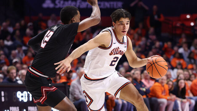 CHAMPAIGN, ILLINOIS - NOVEMBER 11: Andrej Stojakovic #2 of the Illinois Fighting Illini drives to the basket against Donovan Atwell #12 of the Texas Tech Red Raiders during the first half at State Farm Center on November 11, 2025 in Champaign, Illinois.