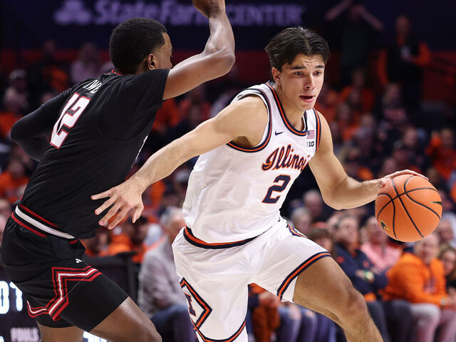 CHAMPAIGN, ILLINOIS - NOVEMBER 11: Andrej Stojakovic #2 of the Illinois Fighting Illini drives to the basket against Donovan Atwell #12 of the Texas Tech Red Raiders during the first half at State Farm Center on November 11, 2025 in Champaign, Illinois.