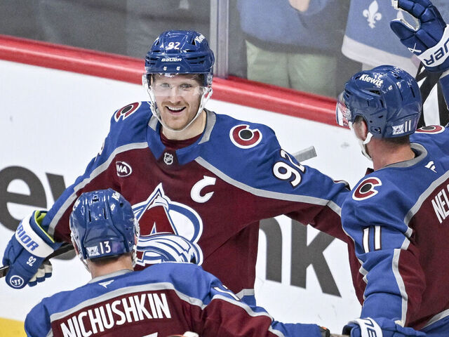 DENVER , CO - NOVEMBER 11: Gabriel Landeskog (92) of the Colorado Avalanche celebrates with Valeri Nichushkin (13) and Brock Nelson (11) after scoring on Lukas Dostal (1) of the Anaheim Ducks during the second period at Ball Arena on Tuesday, November 11, 2025.