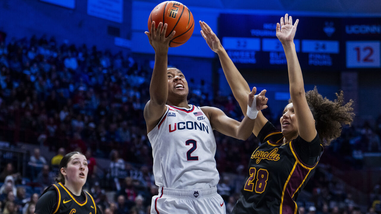 STORRS, CONNECTICUT - NOVEMBER 12: KK Arnold #2 of the Connecticut Huskies goes up for a shot against Clara Djoko #28 of the Loyola Ramblers during the second half on November 12, 2025 in Storrs, Connecticut.