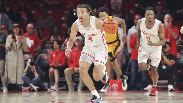 HOUSTON, TX - NOVEMBER 12: Houston Cougars guard Kingston Flemings (4) brings up the ball in the first half during the college men's basketball game between the Oakland Golden Grizzlies and Houston Cougars on November 12, 2025 at Fertitta Center in Houston, Texas.