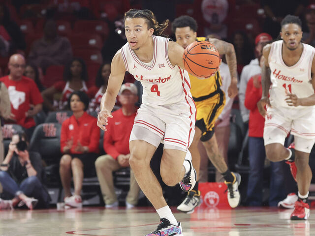 HOUSTON, TX - NOVEMBER 12: Houston Cougars guard Kingston Flemings (4) brings up the ball in the first half during the college men's basketball game between the Oakland Golden Grizzlies and Houston Cougars on November 12, 2025 at Fertitta Center in Houston, Texas.