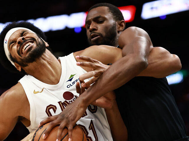 MIAMI, FLORIDA - NOVEMBER 12: Jarrett Allen #31 of the Cleveland Cavaliers battles Andrew Wiggins #22 of the Miami Heat during the second half at Kaseya Center on November 12, 2025 in Miami, Florida.