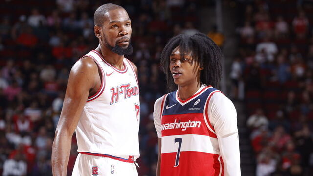 HOUSTON, TX - NOVEMBER 12: Kevin Durant #7 of the Houston Rockets and Bub Carrington #7 of the Washington Wizards looks on during the game on November 12, 2025 at the Toyota Center in Houston, Texas. Mandatory Copyright Notice: Copyright 2025 NBAE