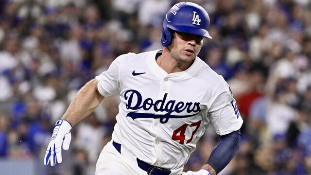 Los Angeles, CA - October 01: Ben Rortvedt #47 of the Los Angeles Dodgers doubles against the Cincinnati Reds in the third inning of game 2 of a National League wild card series baseball game at Dodger Stadium in Los Angeles on Wednesday, October 1, 2025.