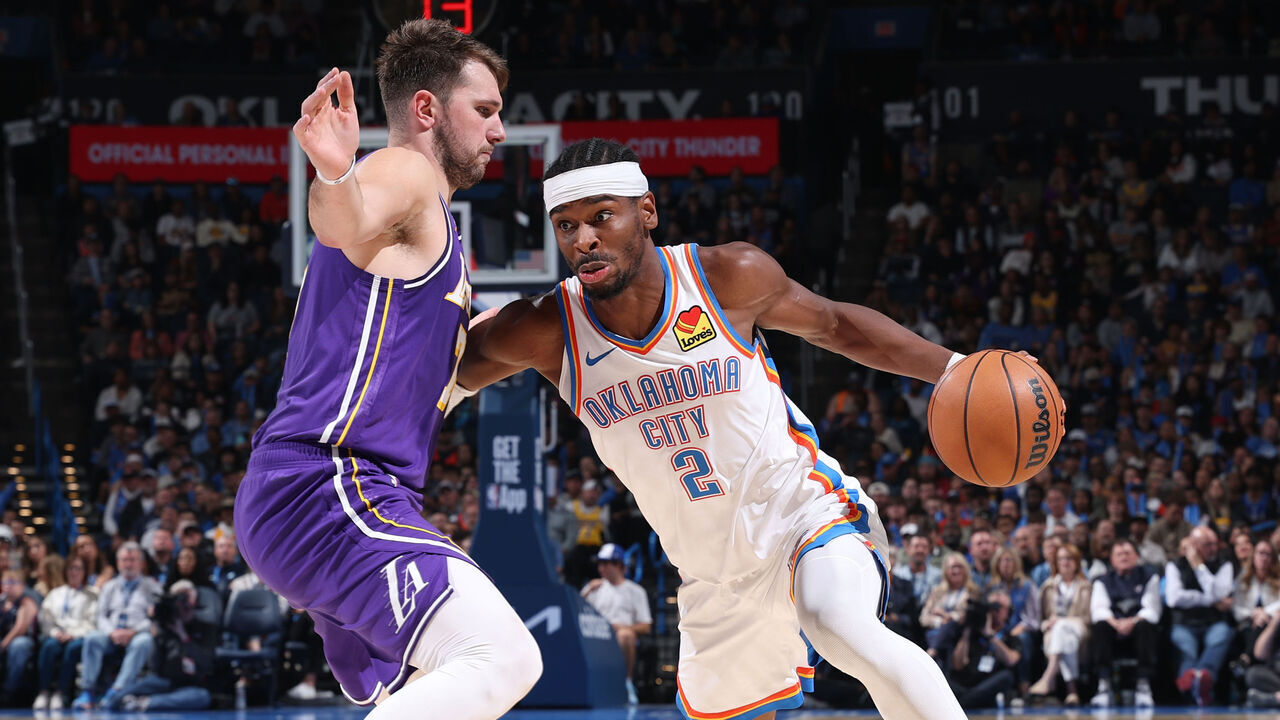 OKLAHOMA CITY, OK - NOVEMBER 12: Shai Gilgeous-Alexander #2 of the Oklahoma City Thunder drives to the basket as Luka Doncic #77 of the Los Angeles Lakers plays defense during the game on November 12, 2025 at Paycom Center in Oklahoma City, Oklahoma. Mandatory Copyright Notice: Copyright 2025 NBAE