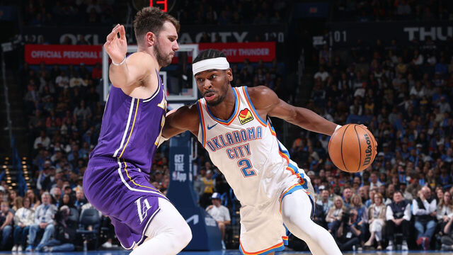 OKLAHOMA CITY, OK - NOVEMBER 12: Shai Gilgeous-Alexander #2 of the Oklahoma City Thunder drives to the basket as Luka Doncic #77 of the Los Angeles Lakers plays defense during the game on November 12, 2025 at Paycom Center in Oklahoma City, Oklahoma. Mandatory Copyright Notice: Copyright 2025 NBAE
